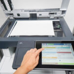 woman press set up printer before scanning business documents