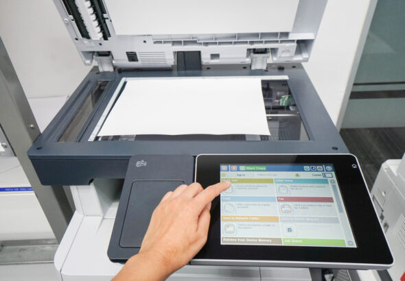 woman press set up printer before scanning business documents