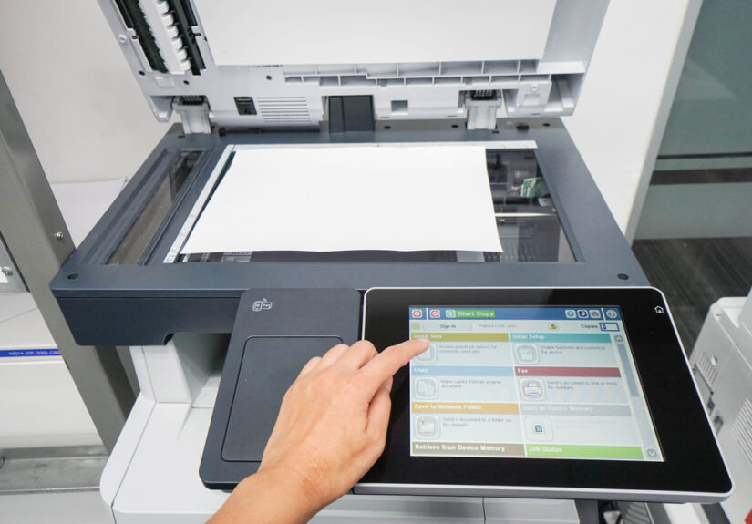 woman press set up printer before scanning business documents